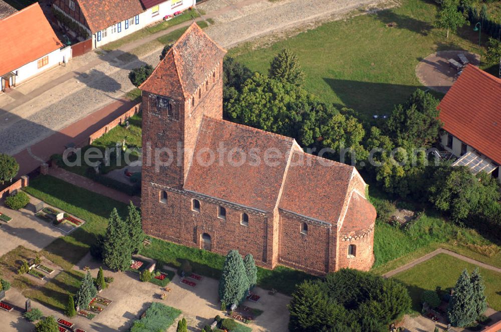 Aerial photograph Melkow - Blick auf die romanische Dorfkirche in Melkow an der Straße der Romanik. Diese Ferienstraße verbindet die Dome, Burgen, Klöster und Kirchen die in der Zeit vom 10. bis Mitte des 13. Jahrhundert entstanden, und somit ein Zeichen der Christianisierung sind. Kontakt: Dorfkirche in Melkow, Dorfstraße, 39524 Melkow-Wust, Deutschland; Tel. +49(39341)406