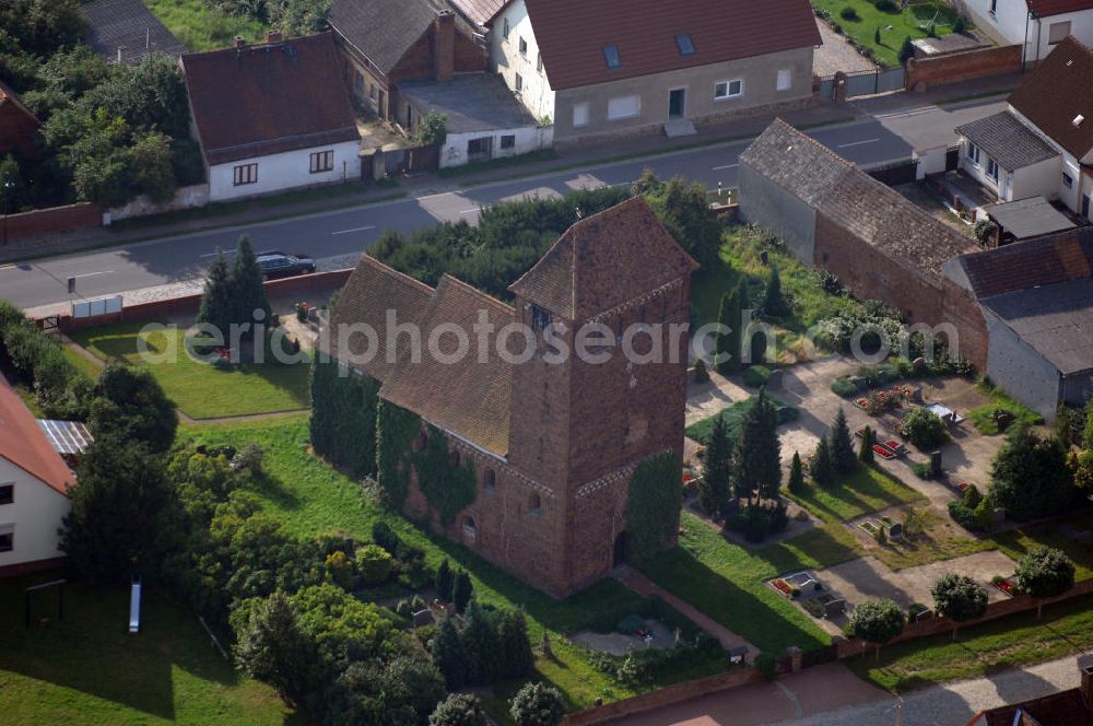 Aerial image Melkow - Blick auf die romanische Dorfkirche in Melkow an der Straße der Romanik. Diese Ferienstraße verbindet die Dome, Burgen, Klöster und Kirchen die in der Zeit vom 10. bis Mitte des 13. Jahrhundert entstanden, und somit ein Zeichen der Christianisierung sind. Kontakt: Dorfkirche in Melkow, Dorfstraße, 39524 Melkow-Wust, Deutschland; Tel. +49(39341)406