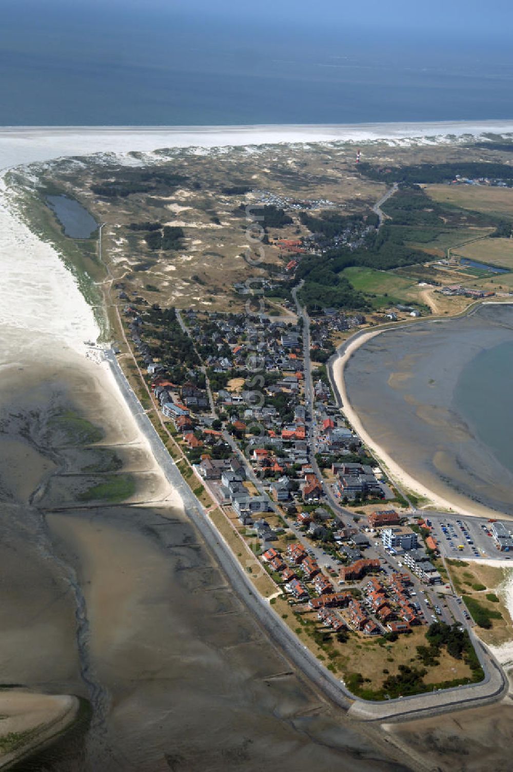 Aerial photograph Wittdün - Blick über Wittdün auf Amrum auf den Seezeichenhafen. Durch den Tonnenanleger werden dort Seezeichen gepflegt und im Fahrwasser ausgelegt. In diesem Hafen legen außerdem ein Rettungskreuzer, Fischkutter, Ausflugsschiffe und Yachten an. Wittdün ist neben Nebel und Norddorf eine der drei Gemeinden auf der Nordseeinsel Amrum. Wittdün ist ein Seeheilbad. Der Tourismus ist die Haupteinnahmequelle. Kontakt: Amt Föhr-Amrum, Hafenstraße 23, 25938 Wyk auf Föhr, Daniel Schenck Tel. +49 (0)4681 5004 824