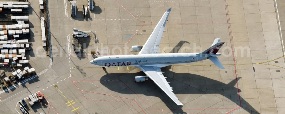 Aerial photograph Berlin - Dispatch building and terminals on the premises of the airport Tegel Tegel with QATAR cargo plane on the apron in Berlin