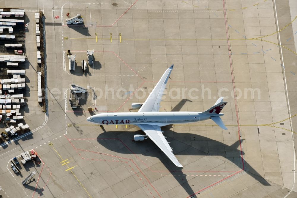 Berlin from above - Dispatch building and terminals on the premises of the airport Tegel Tegel with QATAR cargo plane on the apron in Berlin