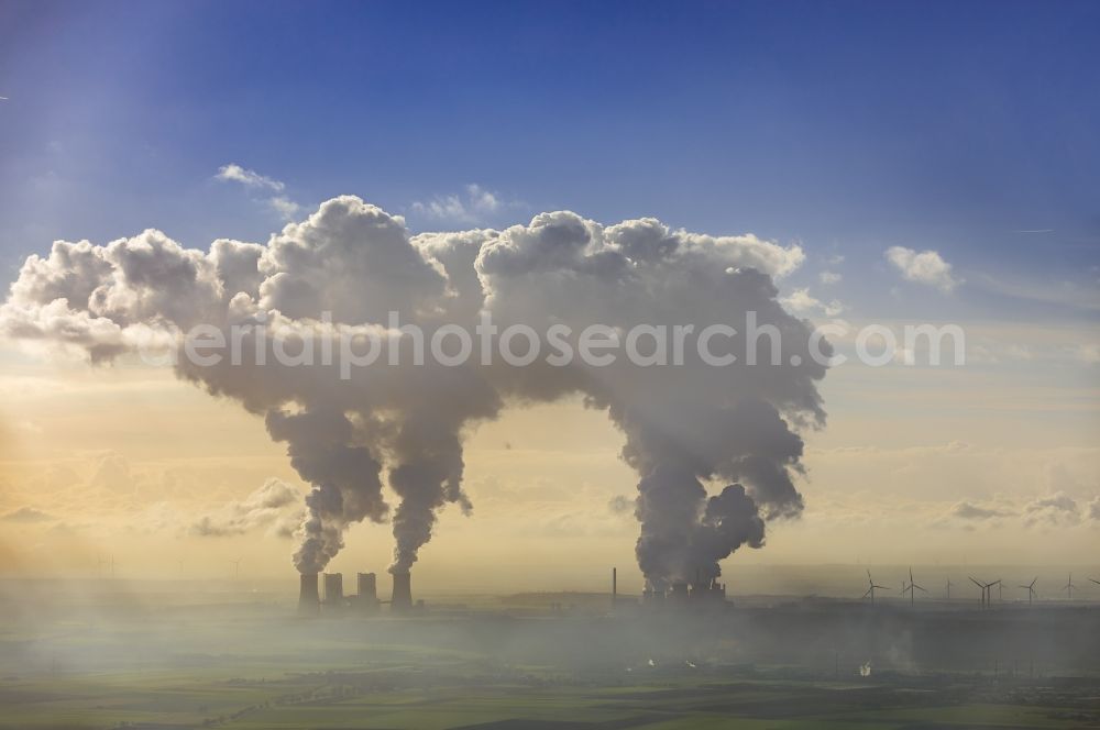 Grevenbroich from the bird's eye view: White exhaust smoke plumes from the power plants and exhaust towers of the coal-fired cogeneration plant Frimmersdorf in Grevenbroich in the state North Rhine-Westphalia, Germany