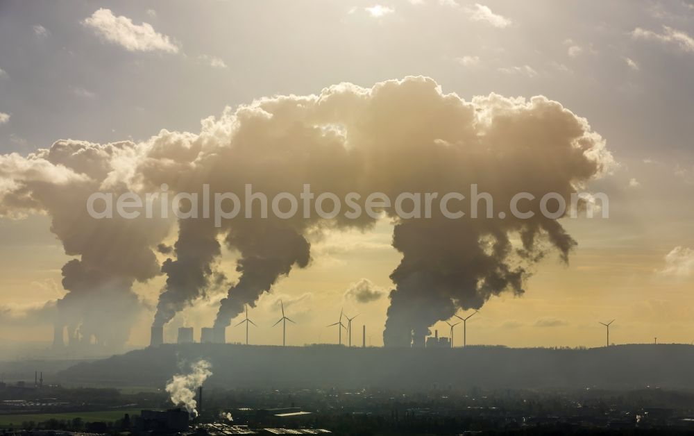 Grevenbroich from the bird's eye view: White exhaust smoke plumes from the power plants and exhaust towers of the coal-fired cogeneration plant Frimmersdorf in Grevenbroich in the state North Rhine-Westphalia, Germany