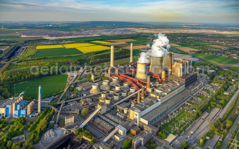 Eschweiler from above - White exhaust smoke plumes from the power plants and exhaust towers of the coal-fired cogeneration plant on street Am Kraftwerk in the district Weisweiler in Eschweiler in the state North Rhine-Westphalia, Germany