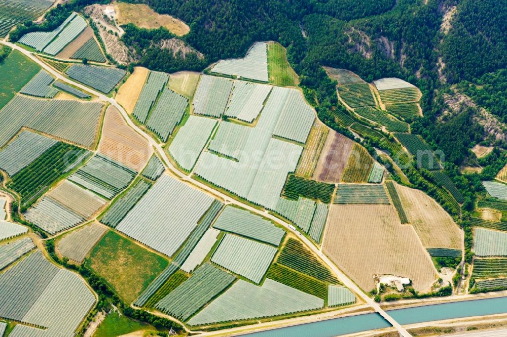 Vitrolles from the bird's eye view: For protection against birds covered tree rows of a fruit plantation on a field in Vitrolles in Provence-Alpes-Cote d'Azur, France