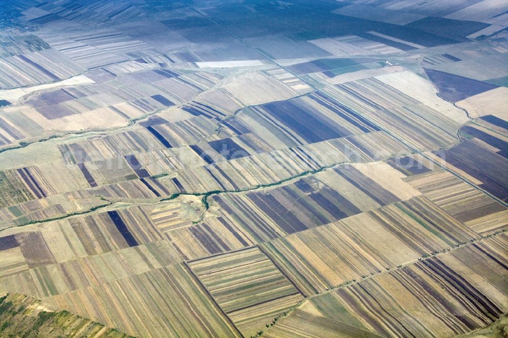 Aerial image Posta Calnau - View of harvested fields near Posta Calnau in the district / Judetul Buzau in the region Wallachai / Muntenia in Romania