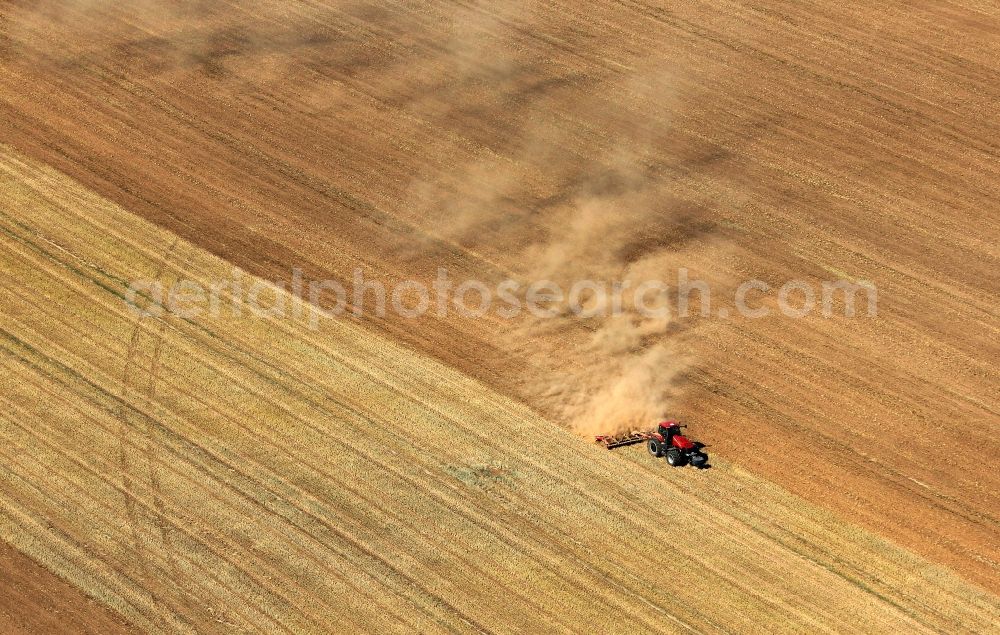 Nauen from above - Field structures of a harvested grain field in Nauen in the state Brandenburg