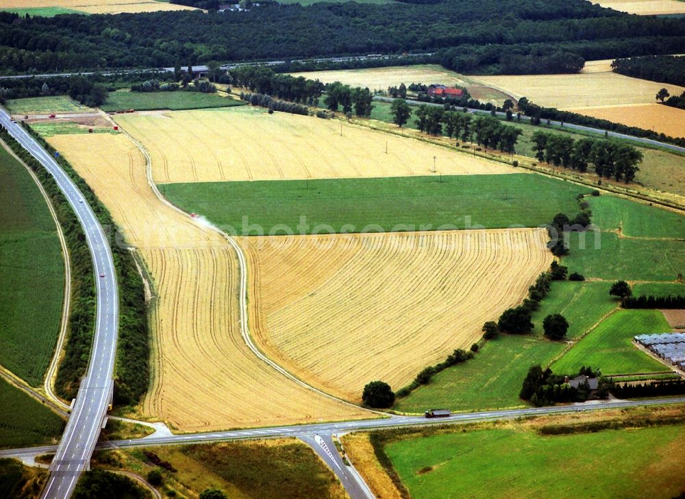 Rheinberg from above - Field structures of a harvested grain field in Rheinberg in the state North Rhine-Westphalia