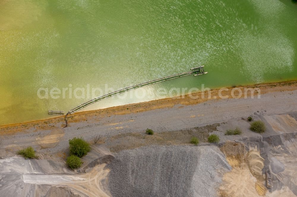 Brilon from the bird's eye view: Deposits and rinsing fields on the quarry for the mining and handling of of Rheinkalk Messinghausen GmbH & Co. KG in Brilon in the state North Rhine-Westphalia, Germany