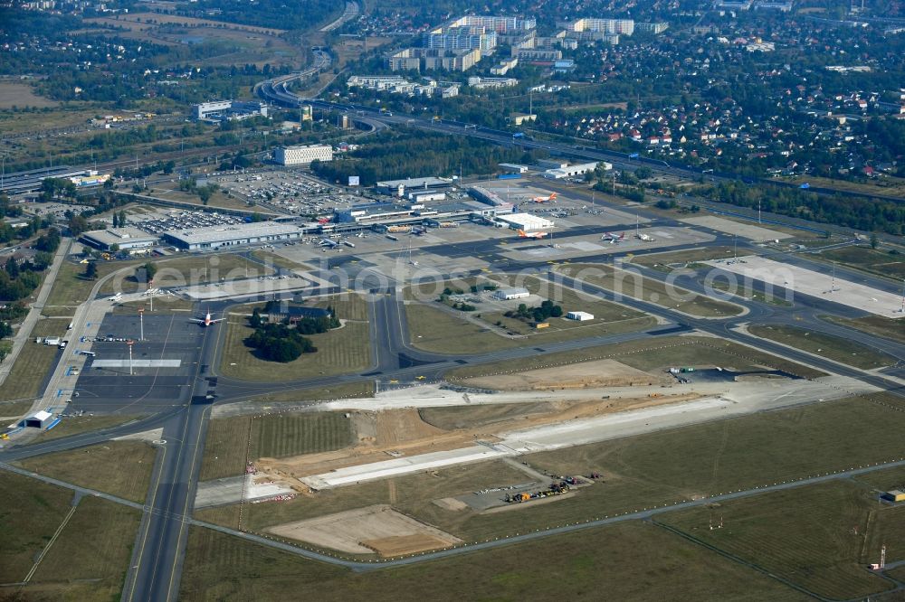 Schönefeld from the bird's eye view: Demolition and unsealing work on the concrete surfaces of old runway in Schoenefeld in the state Brandenburg, Germany