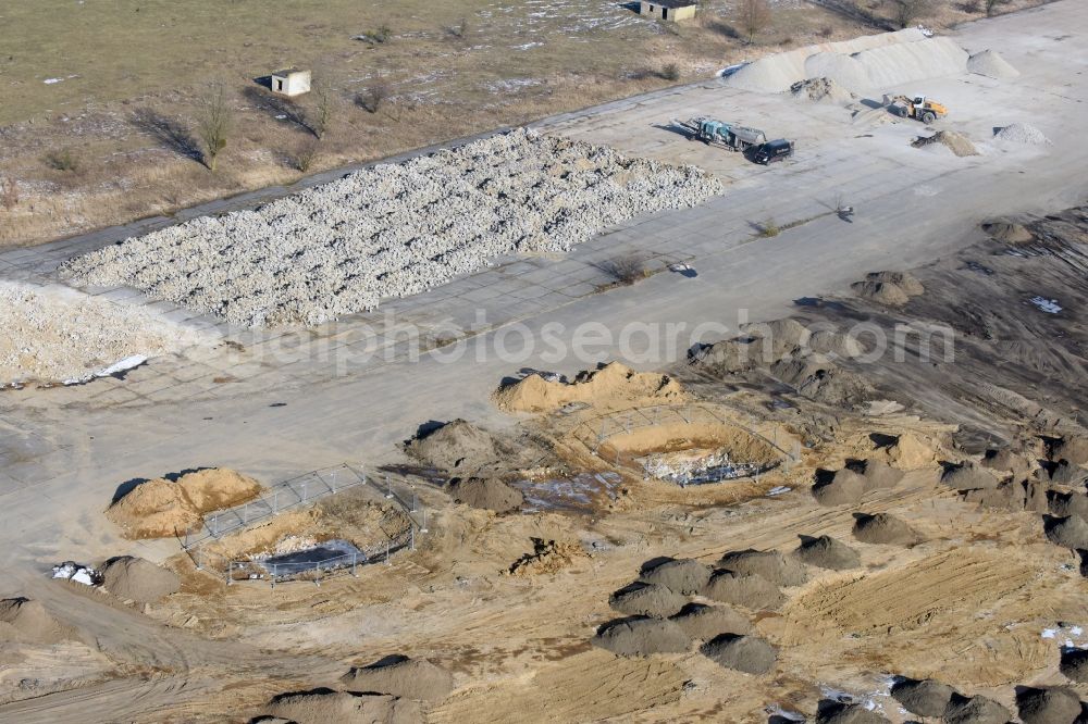 Werneuchen from the bird's eye view: Demolition and unsealing work on the concrete surfaces the former storage areas and taxiways of the airfield in Werneuchen in the state Brandenburg