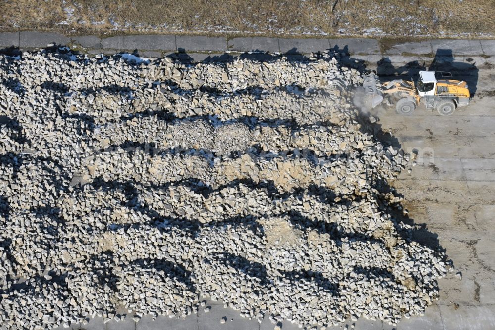 Werneuchen from the bird's eye view: Demolition and unsealing work on the concrete surfaces the former storage areas and taxiways of the airfield in Werneuchen in the state Brandenburg