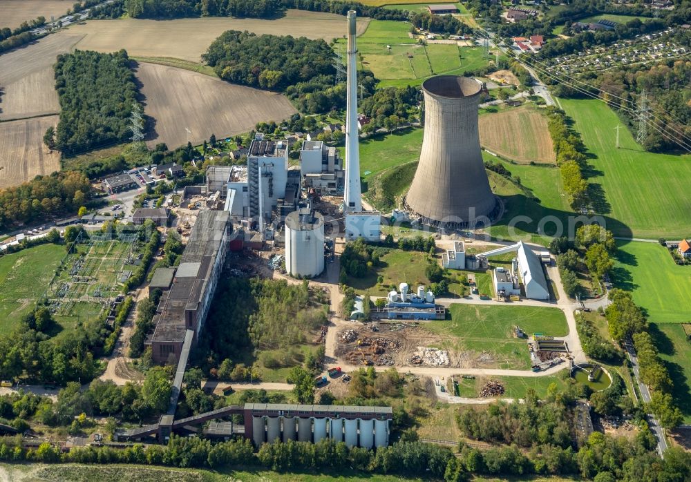 Dortmund from the bird's eye view: Demolition and dismantling of the decommissioned power plants and exhaust towers of the cogeneration plant Gustav Knepper in the district Mengede in Dortmund in the state North Rhine-Westphalia, Germany