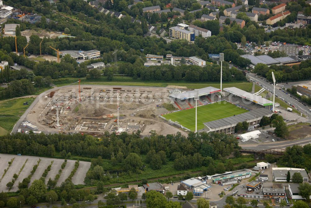 Essen from the bird's eye view: Abrissarbeiten am Georg-Melches-Stadion vom Fußballclub Rot-Weiss Essen in der Stadt Essen, Nordrhein-Westfalen. Gleichzeitig wird ein neues Fußballstadion, welches ca. 20000 Zuschauern Platz bieten soll, leicht versetzt in unmittelbarer Nachbarschaft gebaut. Für die Arbeiten wurde das Bauunternehmen Köster Bau AG beauftragt. Demolition works on the Georg Melches stadium of the soccer club Rot Weiss Essen in Essen, North Rhine-Westphalia. At the same time, a new football stadium is being built in close vicinity to the old stadium. Responsible for the construction work is the building company Koester Bau AG.