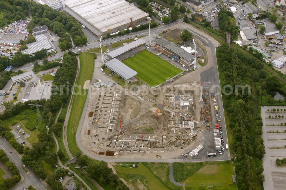 Essen from the bird's eye view: Abrissarbeiten am Georg-Melches-Stadion vom Fußballclub Rot-Weiss Essen in der Stadt Essen, Nordrhein-Westfalen. Gleichzeitig wird ein neues Fußballstadion, welches ca. 20000 Zuschauern Platz bieten soll, leicht versetzt in unmittelbarer Nachbarschaft gebaut. Für die Arbeiten wurde das Bauunternehmen Köster Bau AG beauftragt. Demolition works on the Georg Melches stadium of the soccer club Rot Weiss Essen in Essen, North Rhine-Westphalia. At the same time, a new football stadium is being built in close vicinity to the old stadium. Responsible for the construction work is the building company Koester Bau AG.