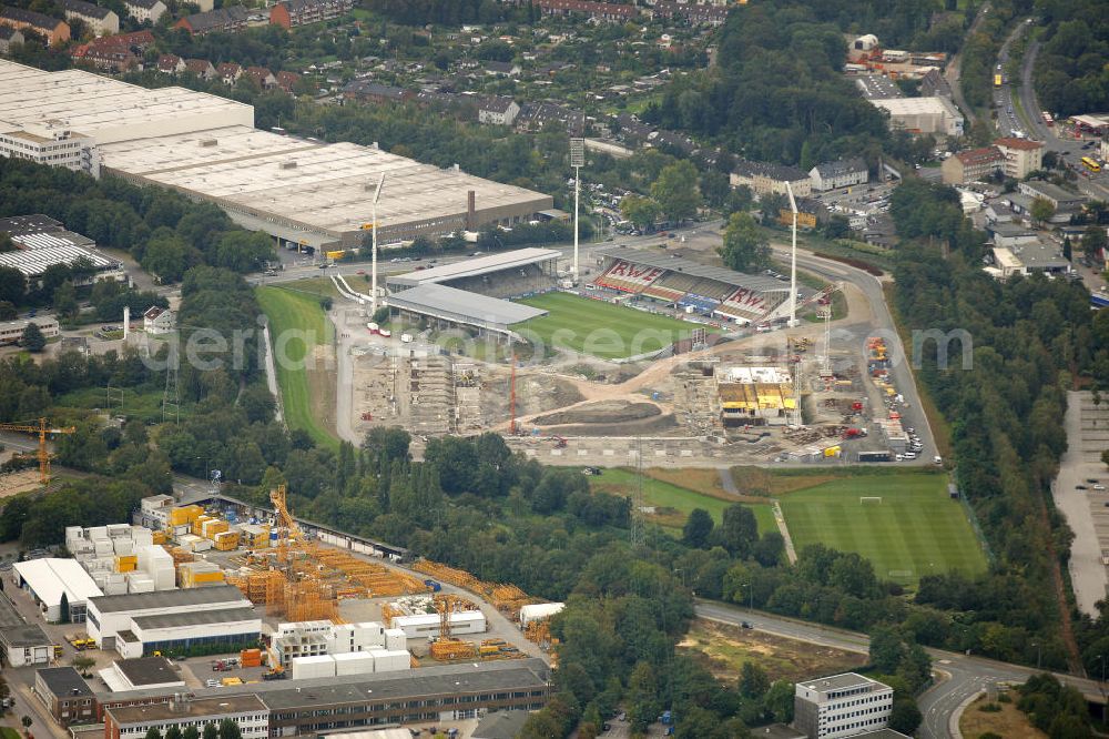 Aerial image Essen - Abrissarbeiten am Georg-Melches-Stadion vom Fußballclub Rot-Weiss Essen in der Stadt Essen, Nordrhein-Westfalen. Gleichzeitig wird ein neues Fußballstadion, welches ca. 20000 Zuschauern Platz bieten soll, leicht versetzt in unmittelbarer Nachbarschaft gebaut. Für die Arbeiten wurde das Bauunternehmen Köster Bau AG beauftragt. Demolition works on the Georg Melches stadium of the soccer club Rot Weiss Essen in Essen, North Rhine-Westphalia. At the same time, a new football stadium is being built in close vicinity to the old stadium. Responsible for the construction work is the building company Koester Bau AG.