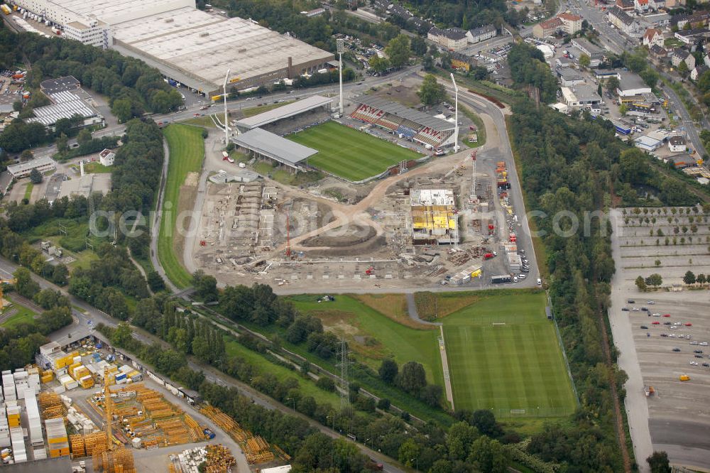 Aerial photograph Essen - Abrissarbeiten am Georg-Melches-Stadion vom Fußballclub Rot-Weiss Essen in der Stadt Essen, Nordrhein-Westfalen. Gleichzeitig wird ein neues Fußballstadion, welches ca. 20000 Zuschauern Platz bieten soll, leicht versetzt in unmittelbarer Nachbarschaft gebaut. Für die Arbeiten wurde das Bauunternehmen Köster Bau AG beauftragt. Demolition works on the Georg Melches stadium of the soccer club Rot Weiss Essen in Essen, North Rhine-Westphalia. At the same time, a new football stadium is being built in close vicinity to the old stadium. Responsible for the construction work is the building company Koester Bau AG.