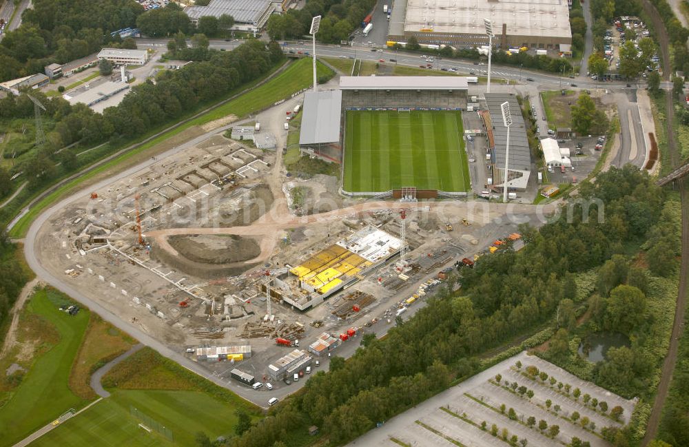 Essen from the bird's eye view: Abrissarbeiten am Georg-Melches-Stadion vom Fußballclub Rot-Weiss Essen in der Stadt Essen, Nordrhein-Westfalen. Gleichzeitig wird ein neues Fußballstadion, welches ca. 20000 Zuschauern Platz bieten soll, leicht versetzt in unmittelbarer Nachbarschaft gebaut. Für die Arbeiten wurde das Bauunternehmen Köster Bau AG beauftragt. Demolition works on the Georg Melches stadium of the soccer club Rot Weiss Essen in Essen, North Rhine-Westphalia. At the same time, a new football stadium is being built in close vicinity to the old stadium. Responsible for the construction work is the building company Koester Bau AG.