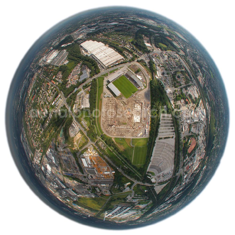 Aerial image Essen - Fish Eye Motiv der Abrissarbeiten am Georg-Melches-Stadion vom Fußballclub Rot-Weiss Essen in der Stadt Essen, Nordrhein-Westfalen. Gleichzeitig wird ein neues Fußballstadion, welches ca. 20000 Zuschauern Platz bieten soll, leicht versetzt in unmittelbarer Nachbarschaft gebaut. Für die Arbeiten wurde das Bauunternehmen Köster Bau AG beauftragt. Demolition works on the Georg Melches stadium of the soccer club Rot Weiss Essen in Essen, North Rhine-Westphalia. At the same time, a new football stadium is being built in close vicinity to the old stadium. Responsible for the construction work is the building company Koester Bau AG.