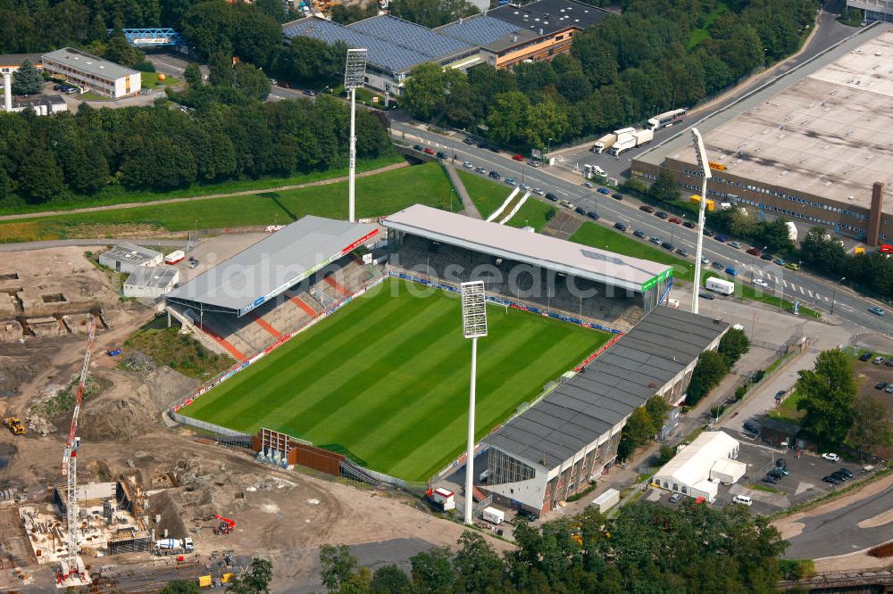 Essen from the bird's eye view: Abrissarbeiten am Georg-Melches-Stadion vom Fußballclub Rot-Weiss Essen in der Stadt Essen, Nordrhein-Westfalen. Gleichzeitig wird ein neues Fußballstadion, welches ca. 20000 Zuschauern Platz bieten soll, leicht versetzt in unmittelbarer Nachbarschaft gebaut. Für die Arbeiten wurde das Bauunternehmen Köster Bau AG beauftragt. Demolition works on the Georg Melches stadium of the soccer club Rot Weiss Essen in Essen, North Rhine-Westphalia. At the same time, a new football stadium is being built in close vicinity to the old stadium. Responsible for the construction work is the building company Koester Bau AG.