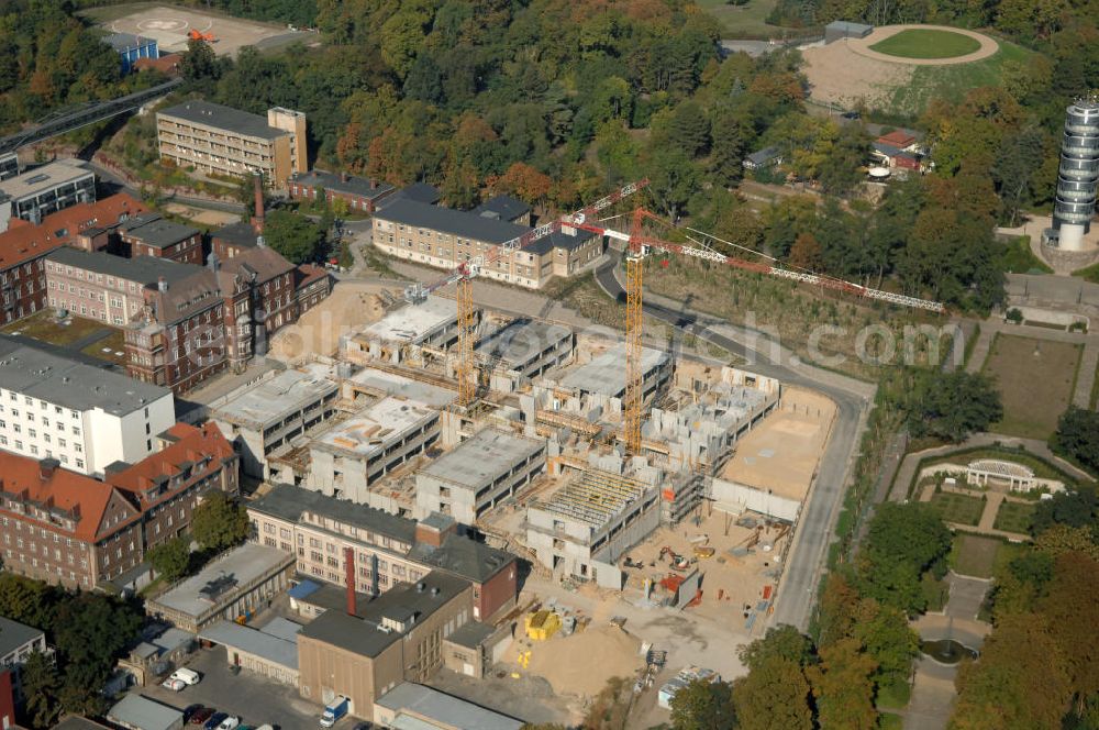 Brandenburg from the bird's eye view: Blick auf die Abriss- und Neubaufläche des Klinikum Brandenburg. Der Krankenhauskomplex ist in etwa 100 Jahre alt. Nach dem ersten Bauabschnitt wurde der Grundstein für den zweiten Bauabschnitt im September 2008 gelegt. Es erfolgte der Abriss der auf dem zukünftigen Baufeld stehenden Gebäude. Geplant sind 10 neue Stationen. Die geplante Fertigstellung ist auf den Anfang des Jahres 2011 gemünzt. Architekten sind Heinle, Wischer und Partner aus Berlin. Kontakt Architekten: Heinle, Wischer und Partner, Freie Architekten, Villastraße 1, 70190 Stuttgart, Tel. +49(0)711 16654 0, Fax +49(0)711 16654 77, Email: stuttgart@heinlewischerpartner.de; Kontakt Klinik: Städtisches Klinikum Brandenburg GmbH, Akademisches Lehrkrankenhaus der Charité, Hochstraße 29, 14770 Brandenburg an der Havel, Tel. +49(0)3381 41 10, Fax +49(0)3381 41 3000, Email: skb@klinikum-brandenburg.de; BATEG Ingenieurbau GmbH, GENIUS IB