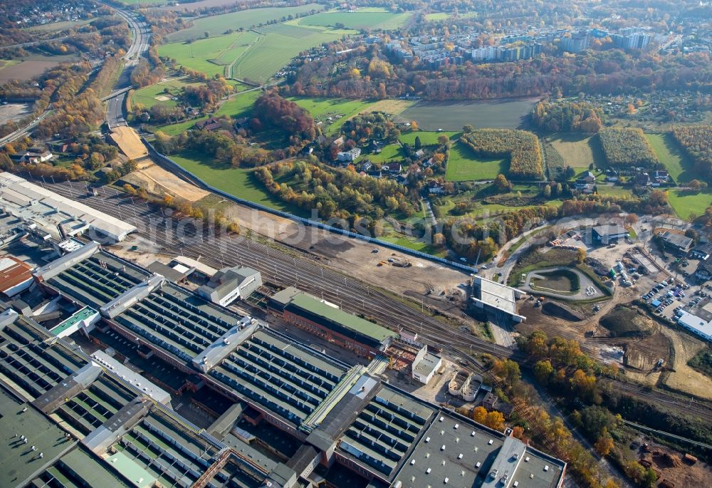 Aerial image Bochum - Demolition of the former paint shop at the Opel plant in Bochum 1 in North Rhine-Westphalia. A spider excavator carries from the tower of the work