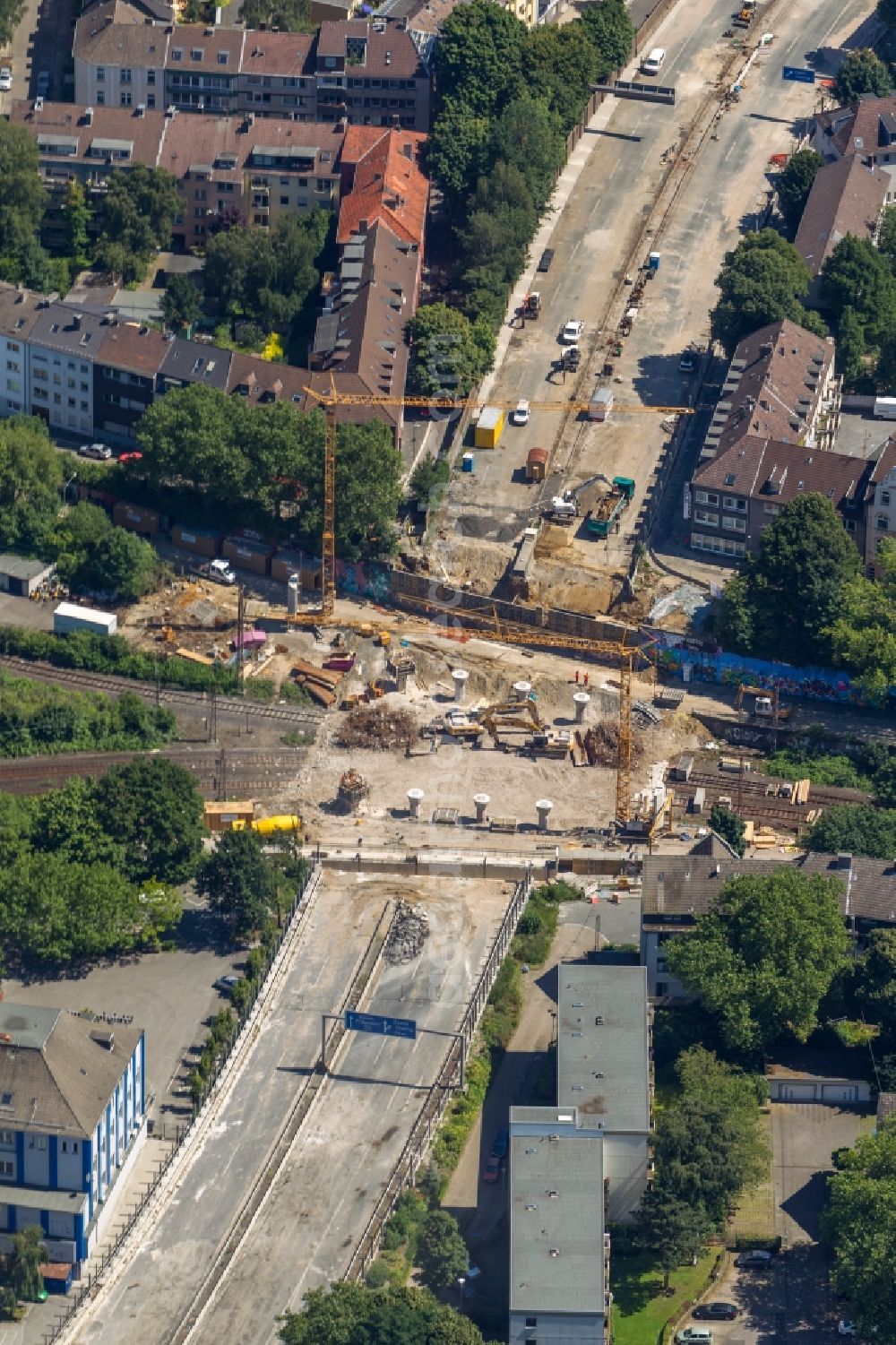 Essen from the bird's eye view: View of the construction side and demolition of the bridge at the town forest known as the big road to motorway A40 in Essen in North Rhine-Westphalia. The demolition work was carried out on behalf of the State Road Construction North Rhine-Westphalia (Road Authority) by the excavator company F. Beißner GmbH