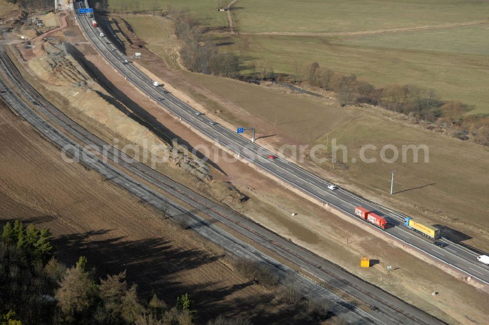 Aerial photograph Sättelstädt - Blick auf die Abrißarbeiten am alten, stillgelegten Streckenverlauf des A4- Autobahnverlaufes an den Hörselbergen in Thüringen bei Eisenach. Durchgeführt werden die im Zuge dieses Projektes notwendigen Arbeiten unter an derem von der EUROVIA Verkehrsbau Union sowie der Niederlassungen Abbruch und Erdbau, Betonstraßenbau, Ingenieurbau und TECO Schallschutz der EUROVIA Beton sowie der DEGES. View of the demolition work on the old, disused itinerary of the A4 motorway course.