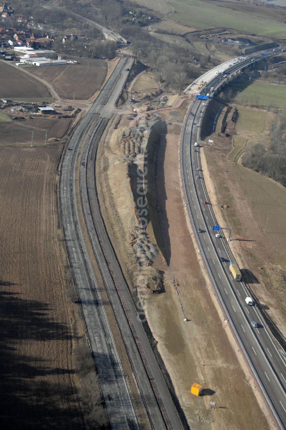 Aerial image Sättelstädt - Blick auf die Abrißarbeiten am alten, stillgelegten Streckenverlauf des A4- Autobahnverlaufes an den Hörselbergen in Thüringen bei Eisenach. Durchgeführt werden die im Zuge dieses Projektes notwendigen Arbeiten unter an derem von der EUROVIA Verkehrsbau Union sowie der Niederlassungen Abbruch und Erdbau, Betonstraßenbau, Ingenieurbau und TECO Schallschutz der EUROVIA Beton sowie der DEGES. View of the demolition work on the old, disused itinerary of the A4 motorway course.