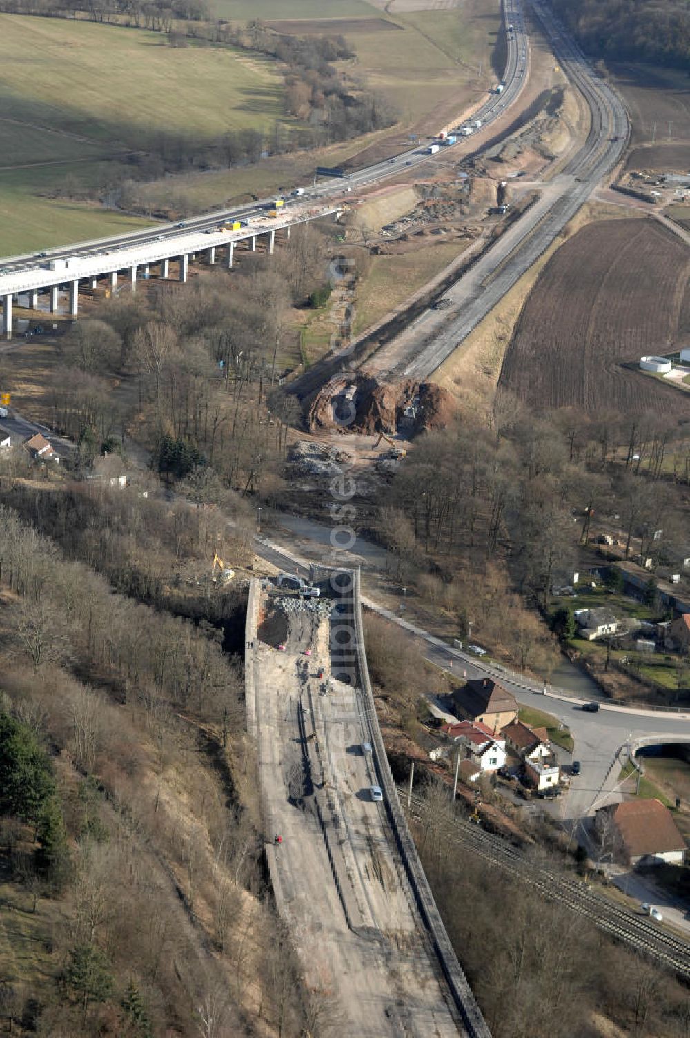 Aerial image Sättelstädt - Blick auf die Abrißarbeiten am alten, stillgelegten Streckenverlauf des A4- Autobahnverlaufes an den Hörselbergen in Thüringen bei Eisenach. Durchgeführt werden die im Zuge dieses Projektes notwendigen Arbeiten unter an derem von der EUROVIA Verkehrsbau Union sowie der Niederlassungen Abbruch und Erdbau, Betonstraßenbau, Ingenieurbau und TECO Schallschutz der EUROVIA Beton sowie der DEGES. View of the demolition work on the old, disused itinerary of the A4 motorway course.