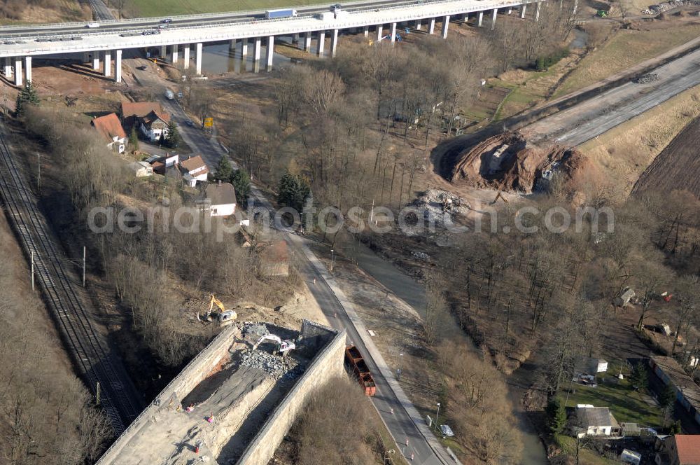 Aerial photograph Sättelstädt - Blick auf die Abrißarbeiten am alten, stillgelegten Streckenverlauf des A4- Autobahnverlaufes an den Hörselbergen in Thüringen bei Eisenach. Durchgeführt werden die im Zuge dieses Projektes notwendigen Arbeiten unter an derem von der EUROVIA Verkehrsbau Union sowie der Niederlassungen Abbruch und Erdbau, Betonstraßenbau, Ingenieurbau und TECO Schallschutz der EUROVIA Beton sowie der DEGES. View of the demolition work on the old, disused itinerary of the A4 motorway course.