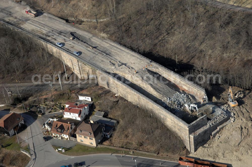 Aerial photograph Sättelstädt - Blick auf die Abrißarbeiten am alten, stillgelegten Streckenverlauf des A4- Autobahnverlaufes an den Hörselbergen in Thüringen bei Eisenach. Durchgeführt werden die im Zuge dieses Projektes notwendigen Arbeiten unter an derem von der EUROVIA Verkehrsbau Union sowie der Niederlassungen Abbruch und Erdbau, Betonstraßenbau, Ingenieurbau und TECO Schallschutz der EUROVIA Beton sowie der DEGES. View of the demolition work on the old, disused itinerary of the A4 motorway course.