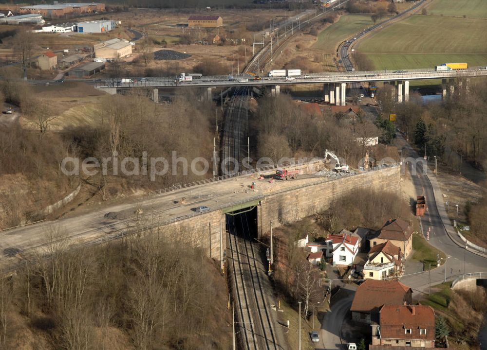 Aerial image Sättelstädt - Blick auf die Abrißarbeiten am alten, stillgelegten Streckenverlauf des A4- Autobahnverlaufes an den Hörselbergen in Thüringen bei Eisenach. Durchgeführt werden die im Zuge dieses Projektes notwendigen Arbeiten unter an derem von der EUROVIA Verkehrsbau Union sowie der Niederlassungen Abbruch und Erdbau, Betonstraßenbau, Ingenieurbau und TECO Schallschutz der EUROVIA Beton sowie der DEGES. View of the demolition work on the old, disused itinerary of the A4 motorway course.