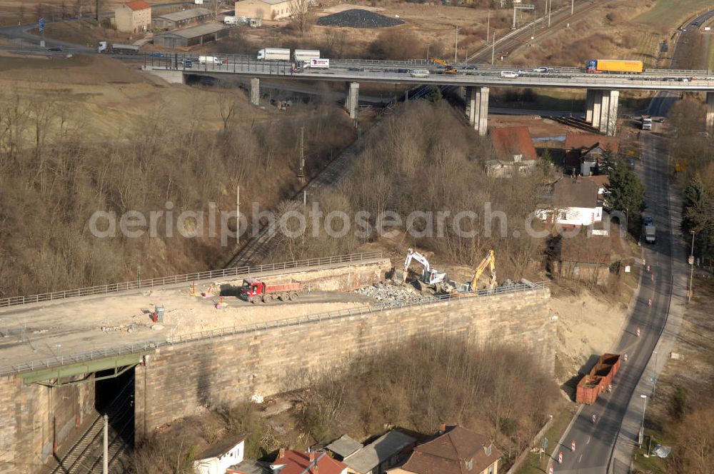 Aerial photograph Sättelstädt - Blick auf die Abrißarbeiten am alten, stillgelegten Streckenverlauf des A4- Autobahnverlaufes an den Hörselbergen in Thüringen bei Eisenach. Durchgeführt werden die im Zuge dieses Projektes notwendigen Arbeiten unter an derem von der EUROVIA Verkehrsbau Union sowie der Niederlassungen Abbruch und Erdbau, Betonstraßenbau, Ingenieurbau und TECO Schallschutz der EUROVIA Beton sowie der DEGES. View of the demolition work on the old, disused itinerary of the A4 motorway course.