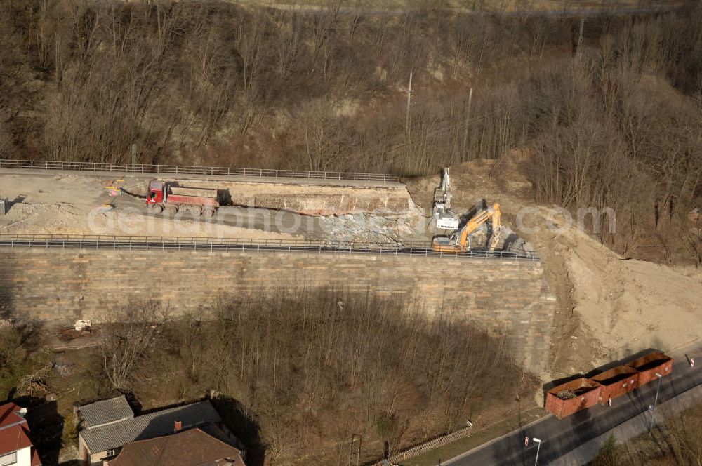 Sättelstädt from the bird's eye view: Blick auf die Abrißarbeiten am alten, stillgelegten Streckenverlauf des A4- Autobahnverlaufes an den Hörselbergen in Thüringen bei Eisenach. Durchgeführt werden die im Zuge dieses Projektes notwendigen Arbeiten unter an derem von der EUROVIA Verkehrsbau Union sowie der Niederlassungen Abbruch und Erdbau, Betonstraßenbau, Ingenieurbau und TECO Schallschutz der EUROVIA Beton sowie der DEGES. View of the demolition work on the old, disused itinerary of the A4 motorway course.