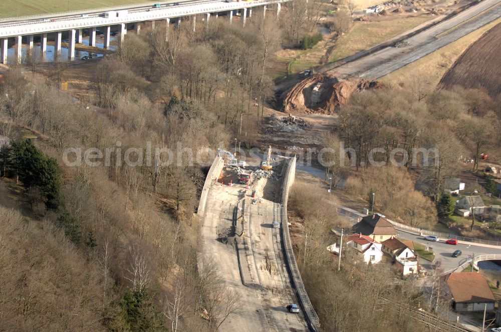 Aerial photograph Sättelstädt - Blick auf die Abrißarbeiten am alten, stillgelegten Streckenverlauf des A4- Autobahnverlaufes an den Hörselbergen in Thüringen bei Eisenach. Durchgeführt werden die im Zuge dieses Projektes notwendigen Arbeiten unter an derem von der EUROVIA Verkehrsbau Union sowie der Niederlassungen Abbruch und Erdbau, Betonstraßenbau, Ingenieurbau und TECO Schallschutz der EUROVIA Beton sowie der DEGES. View of the demolition work on the old, disused itinerary of the A4 motorway course.