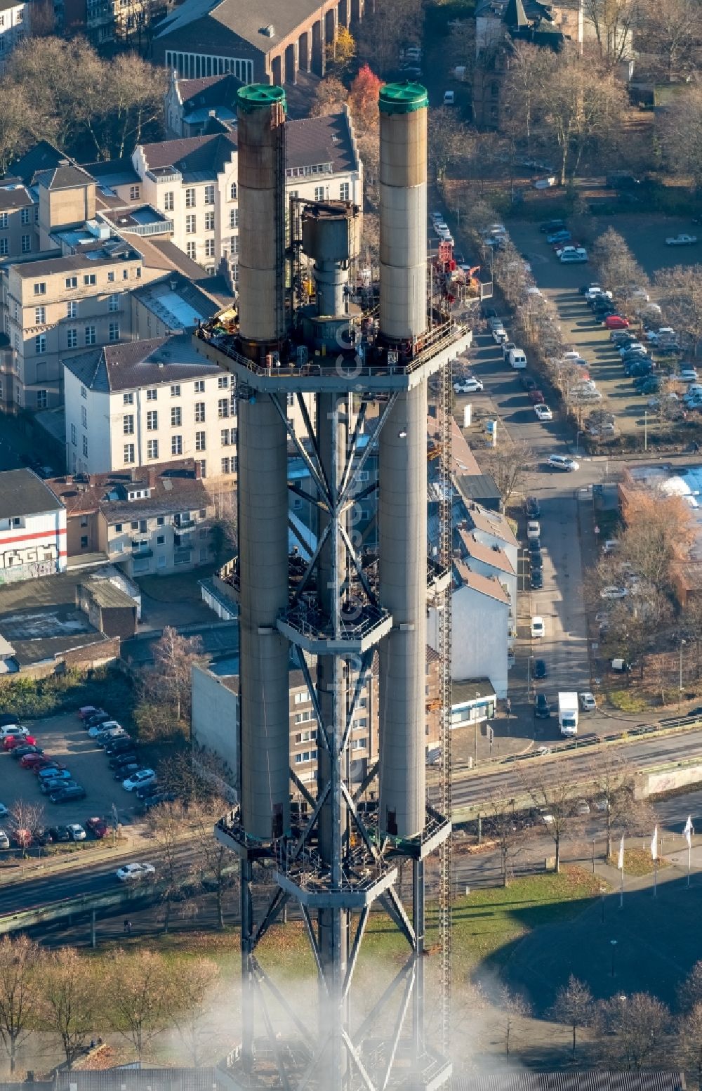 Duisburg from above - Demolition work on the tower constructions of industrial chimneys of STADTWERKE DUISBURG on the Charlottenstrasse in the district Altstadt in Duisburg in the state North Rhine-Westphalia