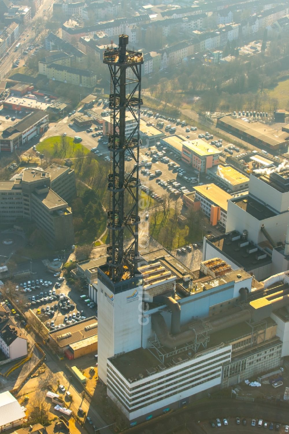 Duisburg from the bird's eye view: Demolition work on the tower constructions of industrial chimneys of STADTWERKE DUISBURG on the Charlottenstrasse in the district Altstadt in Duisburg in the state North Rhine-Westphalia