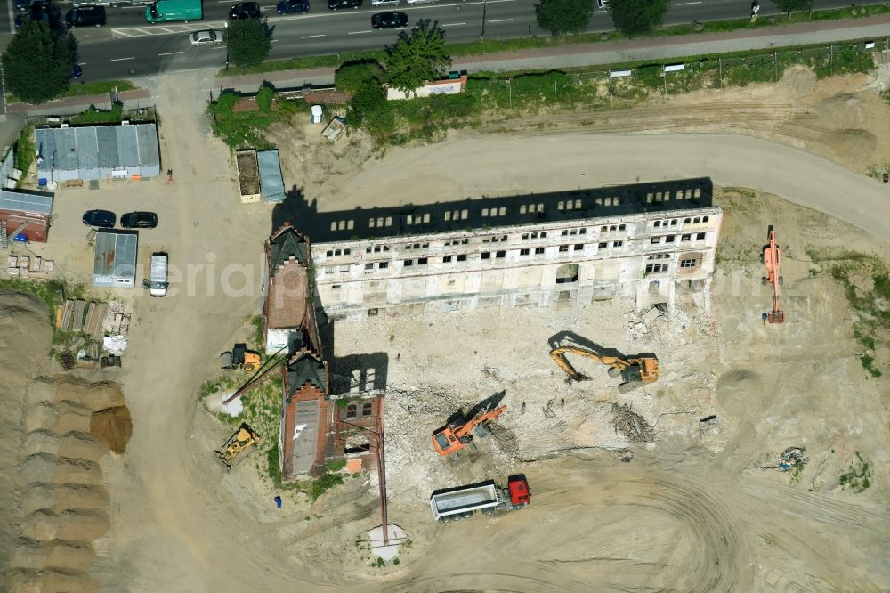 Aerial photograph Berlin - Demolition site of the ruins of the factory building of the former BaerenSiegel distillery on Adlergestell in Adlershof, Berlin. At the construction site of the distinctive production building GDR times development a shopping center