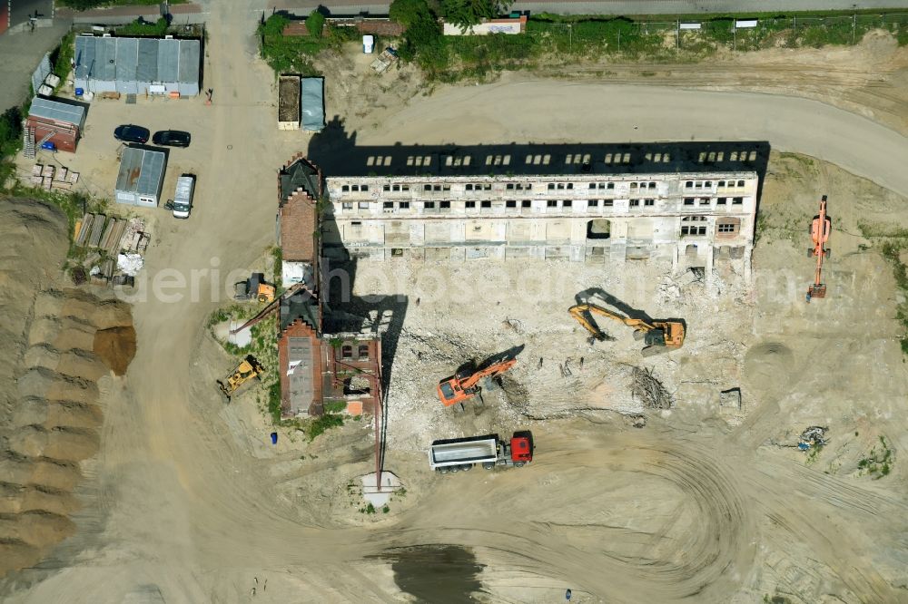 Berlin from above - Demolition site of the ruins of the factory building of the former BaerenSiegel distillery on Adlergestell in Adlershof, Berlin. At the construction site of the distinctive production building GDR times development a shopping center