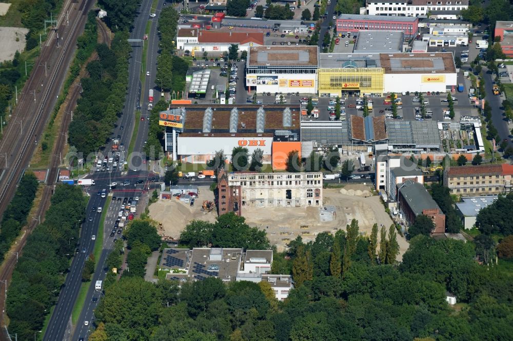 Berlin from the bird's eye view: Demolition site of the ruins of the factory building of the former BaerenSiegel distillery on Adlergestell in Adlershof, Berlin. At the construction site of the distinctive production building GDR times development a shopping center