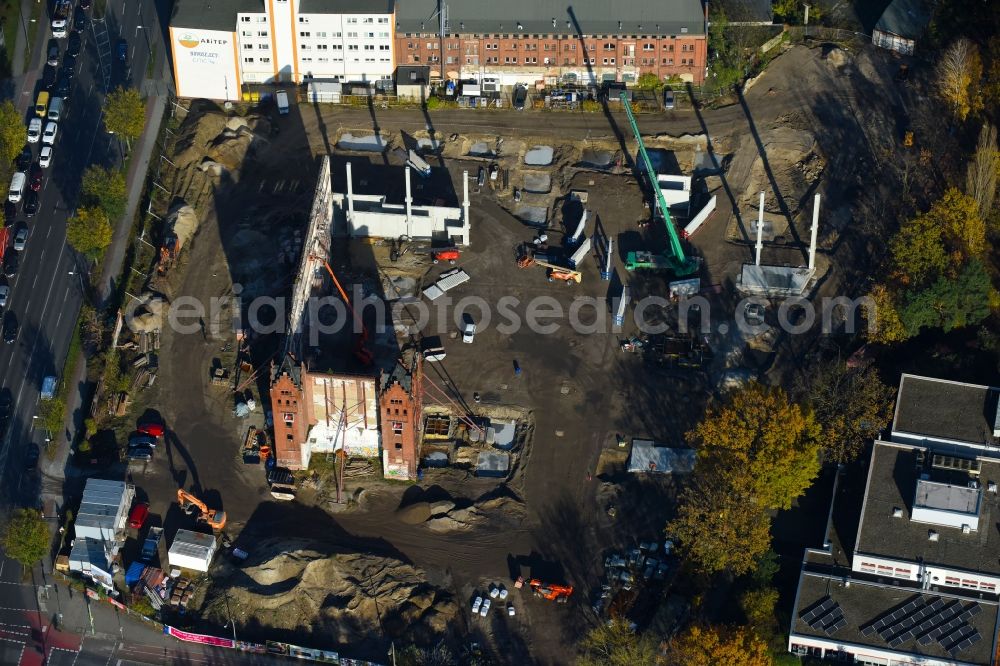 Berlin from above - Demolition site of the ruins of the factory building of the former BaerenSiegel distillery on Adlergestell in Adlershof, Berlin. At the construction site of the distinctive production building GDR times development a shopping center