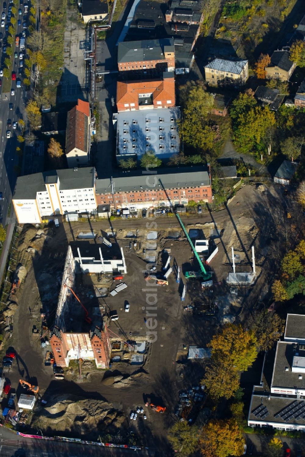 Berlin from the bird's eye view: Demolition site of the ruins of the factory building of the former BaerenSiegel distillery on Adlergestell in Adlershof, Berlin. At the construction site of the distinctive production building GDR times development a shopping center