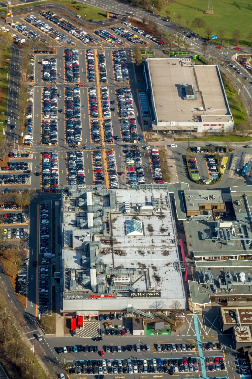 Aerial image Bochum - Parking space for parked cars at the shopping center Ruhr Park in Bochum in the state North Rhine-Westphalia, Germany