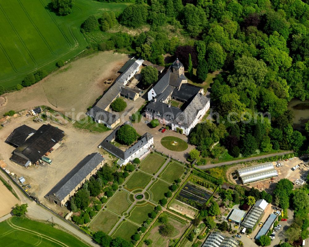 Neuwied from the bird's eye view: Rommersdorf Abbey in the Heimbach-Weis part of the town of Neuwied in the state of Rhineland-Palatinate. The town is located in the county district of Mayen-Koblenz on the right riverbank of the river Rhine. The town is an official tourist resort and is an important historic industrial site. Heimbach-Weis is located in its North. The abbey with its cross-coat is a landmark of the town