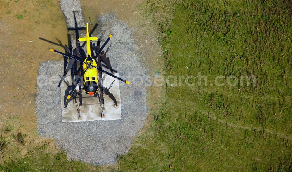 Aerial image Kamen - Blick auf das Autobahnkreuz Kamener Kreuz im Nordosten des Ruhrgebietes bei Kamen. Neu installiert ist das ADAC-Denkmal , einer Skluptur aus acht Figuren , welche einen ausrangierten ADAC- Helikopter tragen. Die Kunstinstallation Gelbe Engel ist ein Werk des Kuenstler Alex Gockel. Rund 200.000 Fahrzeuge passieren täglich das Kreuz und somit hat dieses kunstwerk reale Chancen, zum meistbeachteten Kunstwerk Deutschlands zu werden.