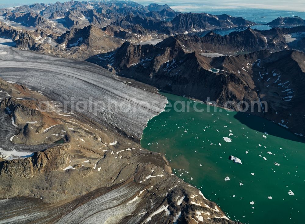 Aerial image Liverpool Land - Tidal glacier Age-Nielsen-Gletscher in the rock and mountain landscape in in Kommuneqarfik Sermersooq, Greenland