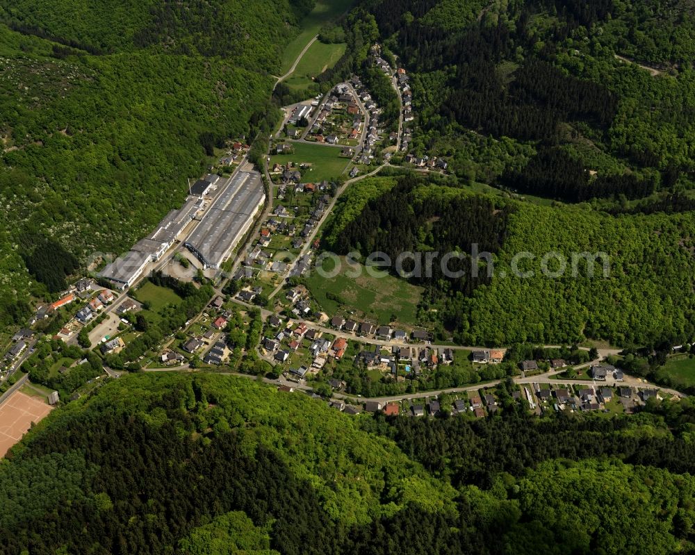 Aerial photograph Ahrbrück - View of Ahrbrueck in Rheinland-Pfalz. The village is located on the road L85. In the center of Ahrbrueck, there is a large warehouse complex, which belongs to the company Rolladen Berthold Weidenbach