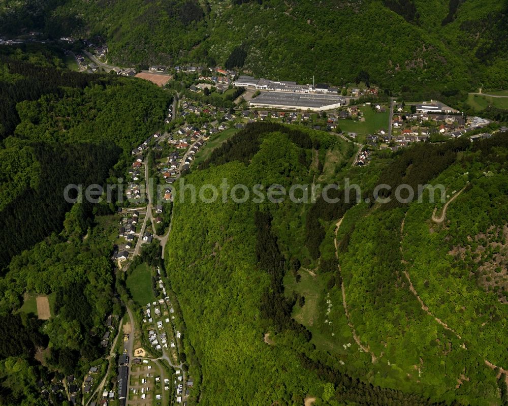 Ahrbrück from the bird's eye view: View of Ahrbrueck in Rheinland-Pfalz. The village is located on the road L85. In the center of Ahrbrueck, there is a large warehouse complex, which belongs to the company Rolladen Berthold Weidenbach