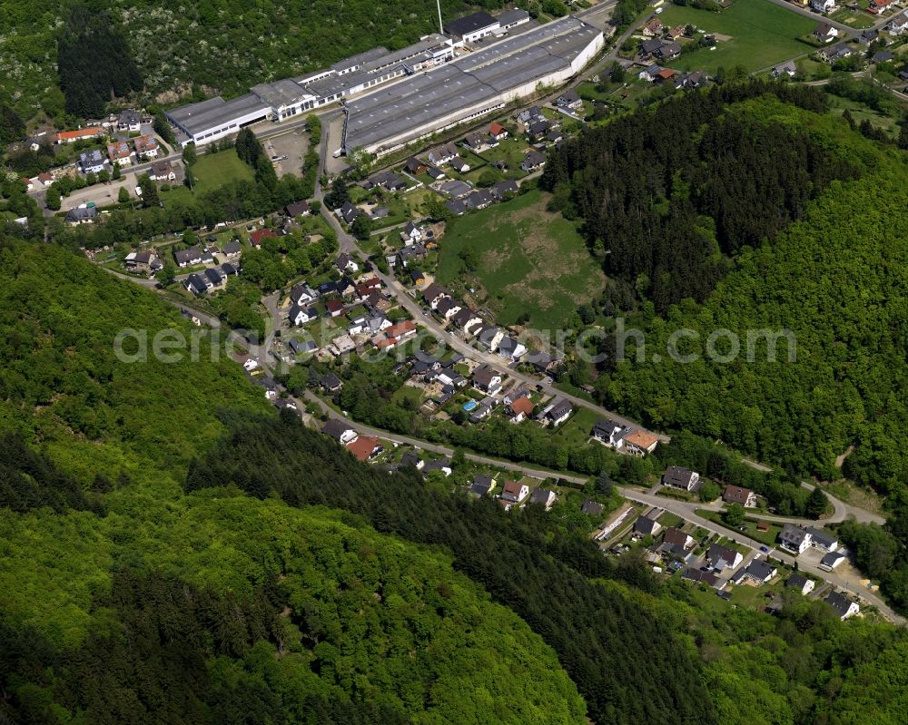 Aerial photograph Ahrbrück - View of Ahrbrueck in Rheinland-Pfalz. The village is located on the road L85. In the center of Ahrbrueck, there is a large warehouse complex, which belongs to the company Rolladen Berthold Weidenbach